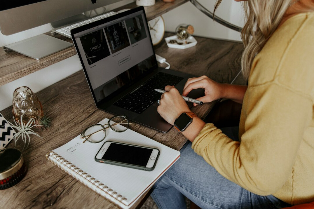 person working remotely on laptop