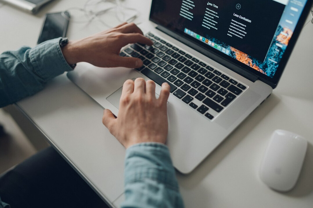 person learning programming on laptop