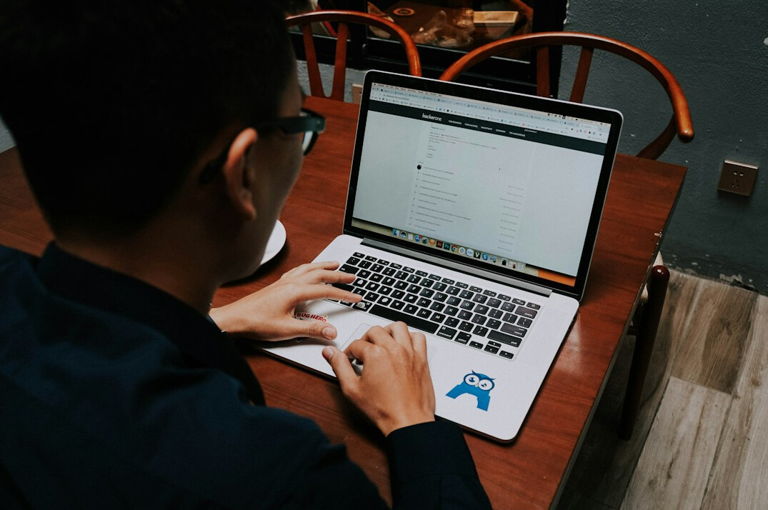 programmer working on laptop